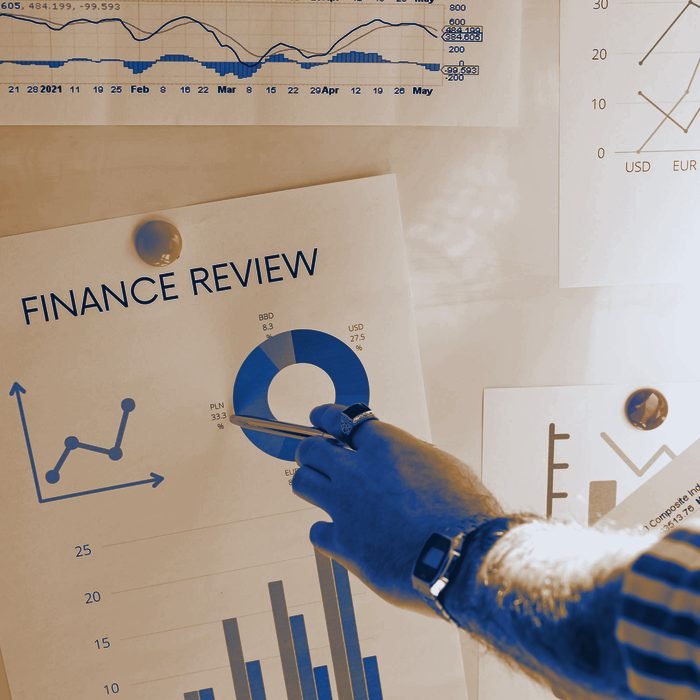 A printed finance review being talked through